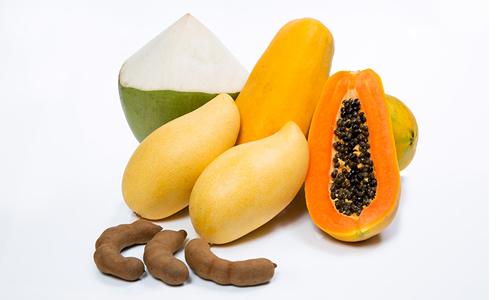 Many of Thailand’s native fruits offer more than nourishment and can be used medicinally and in beauty treatments, including (clockwise from bottom) Tamarind, Mango, Coconut, and Papaya