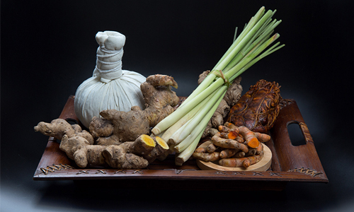 Clockwise from front right, Tumeric, Lemongrass, Plai, Thai Herbal Compress Pouch, and Tamarind